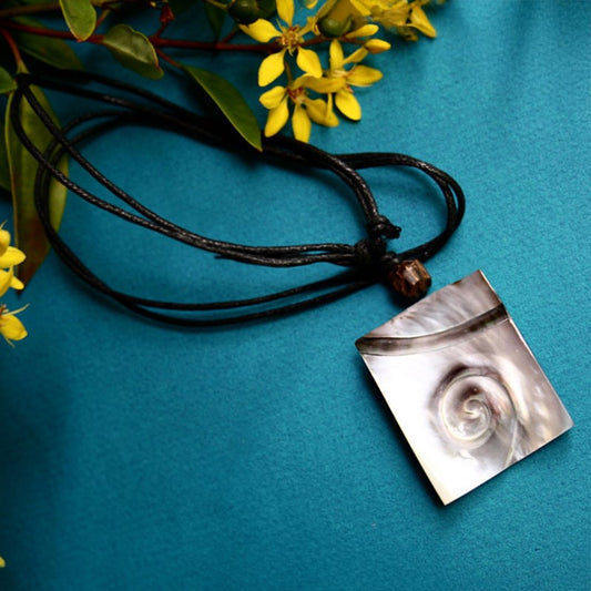 Carved pearl shell with leather choker 1