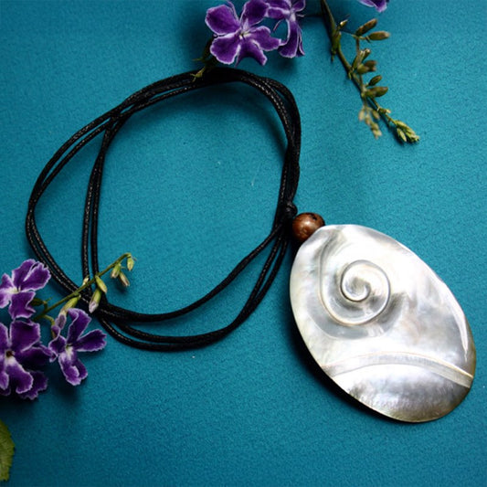 Carved pearl shell with leather choker 9
