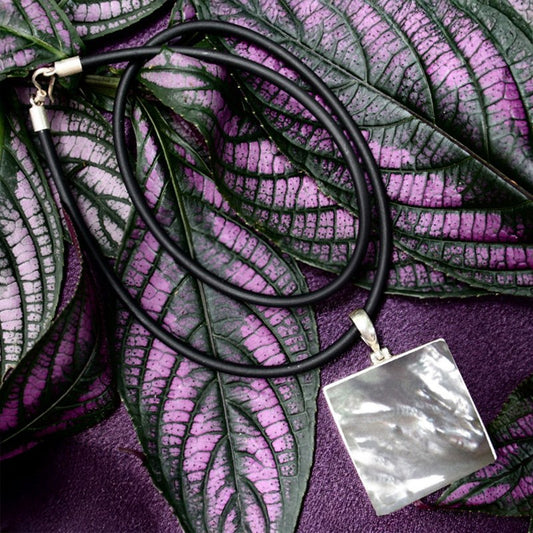 Carved pearl shell with silver without cord 13