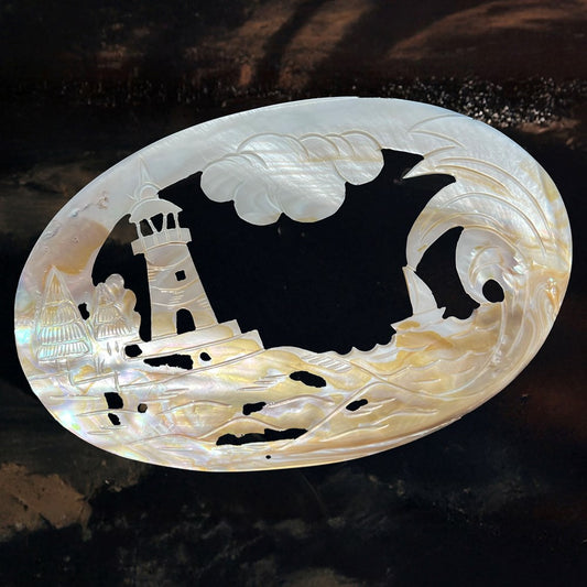 Mussel giant pearl carved lighthouse half